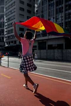 Loud And Proud: 4 Vibrant Ways To Mark Pride Month 1 A Person Holding A Pride Month Flag
